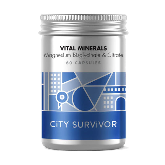 A metal screw top pot with blue abstract cityscape design featuring a pigeon logo. Label text reads City Survivor Vital Minerals Magnesium Bisglycinate & Citrate - 60 capsules